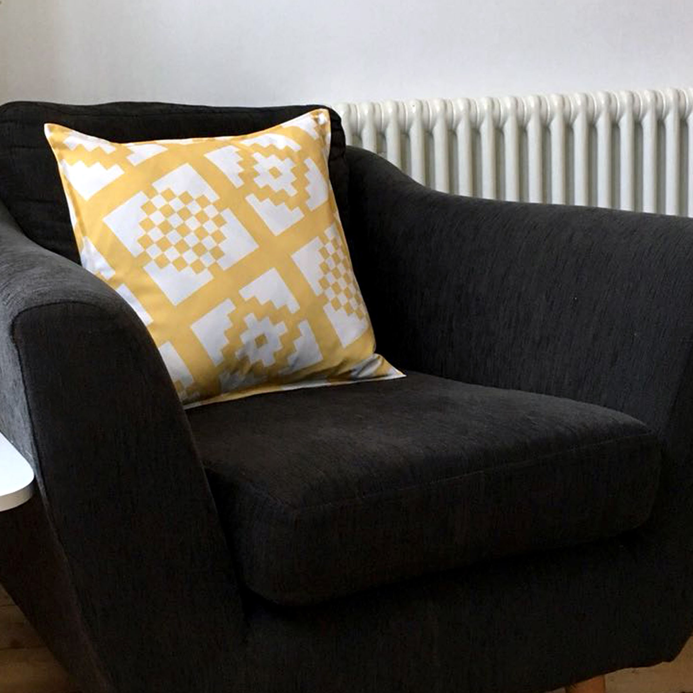 mustard geo-print cushion