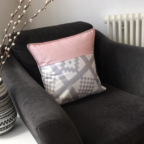 grey and pink geo-print cushion